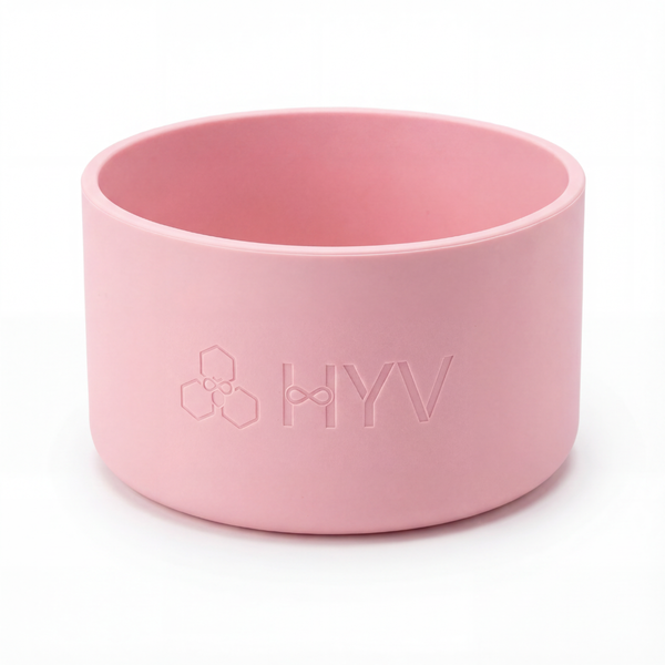 HYV silicone bottle boot in soft pink, embossed with the HYV mark