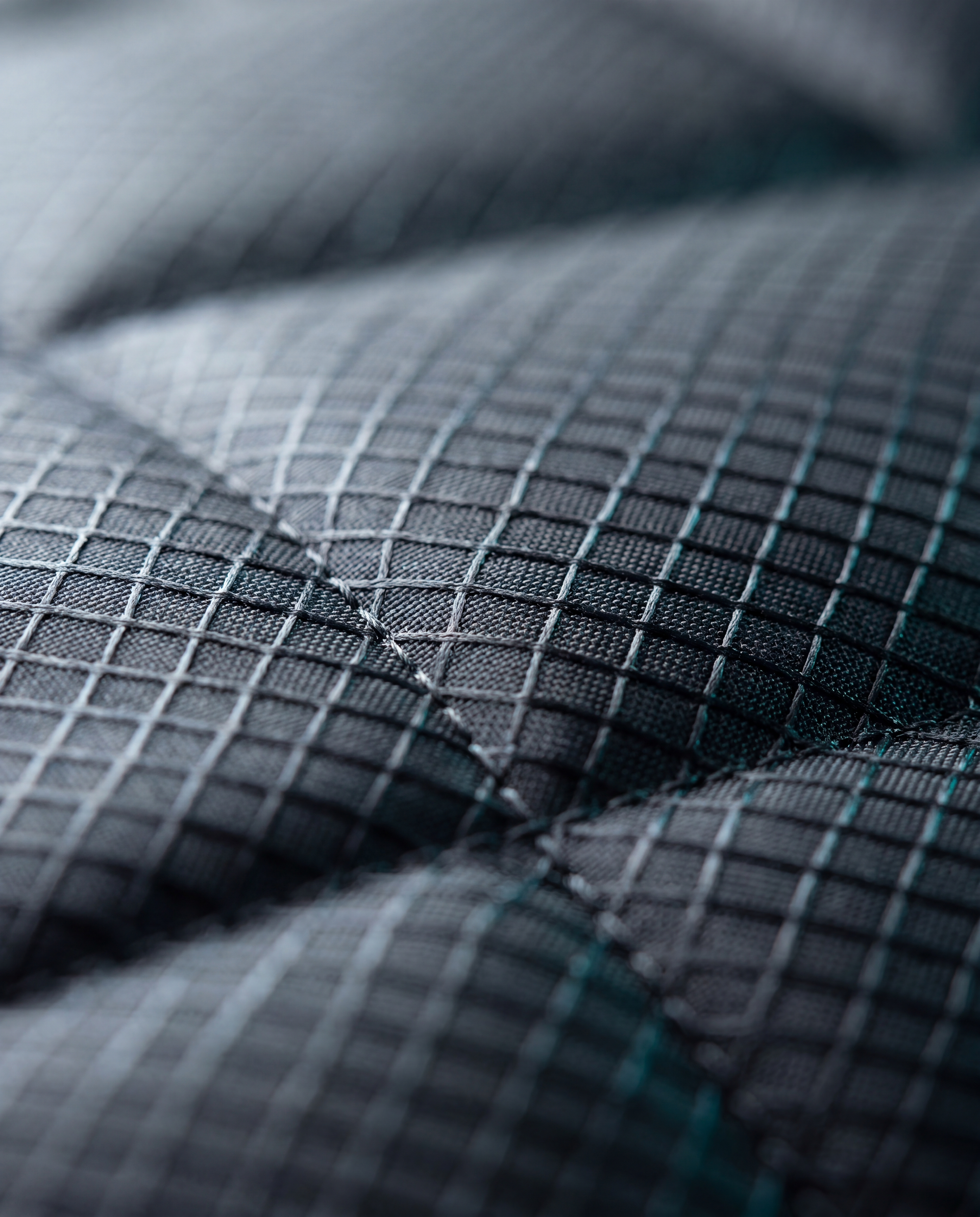 Premium technical fabric with bonded seams — recovery-grade build detail