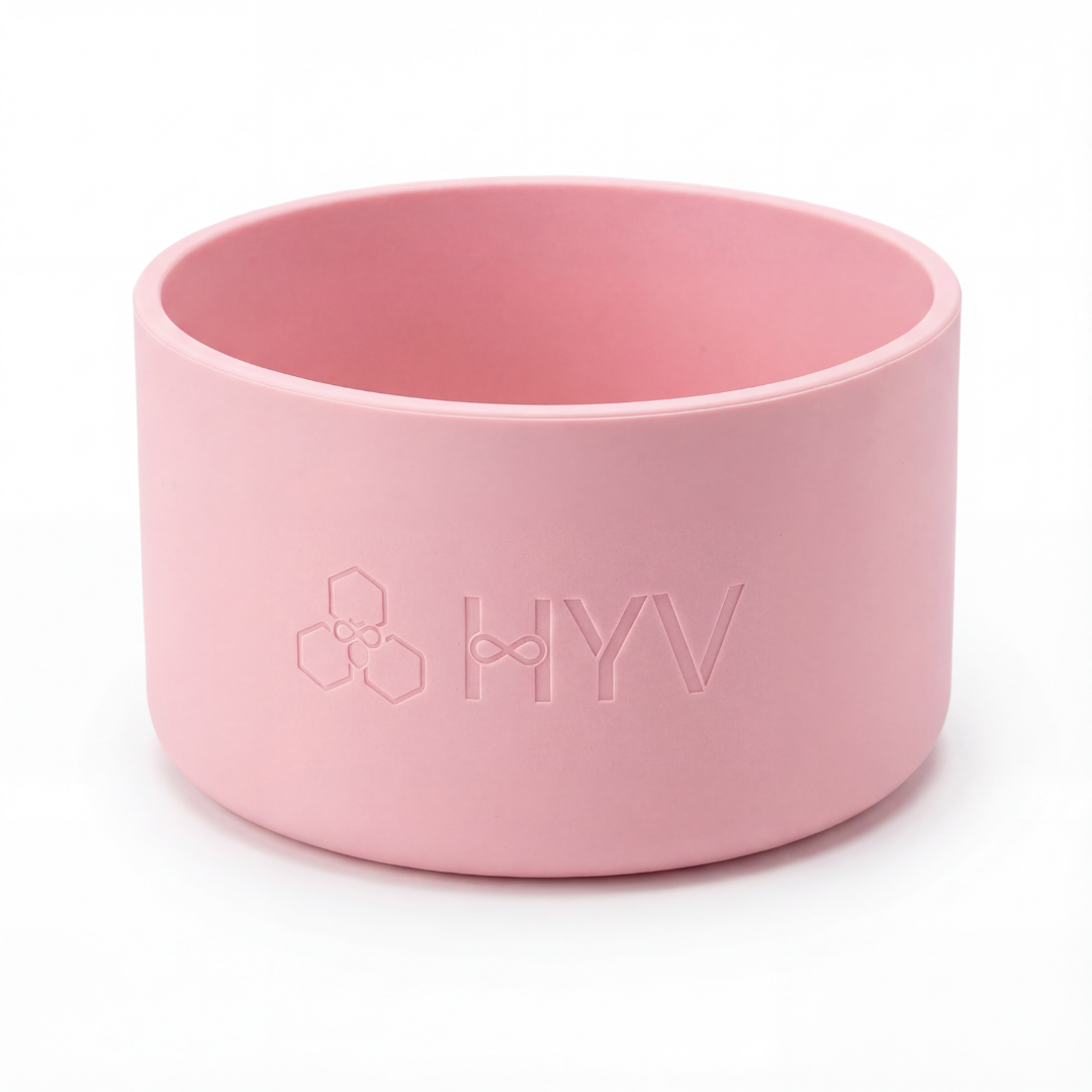 HYV silicone bottle boot in soft pink, embossed with the HYV mark