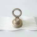 HYV MagSafe chug lid in cashmere beige, its magnetic ring folded upright
