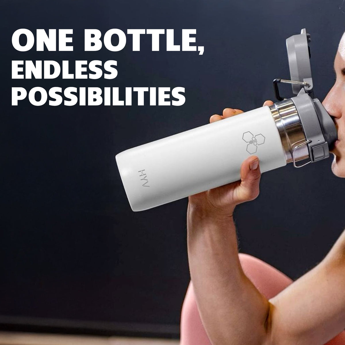 Man drinking from a white HYV FlipFlow bottle, thumb on the flip lid