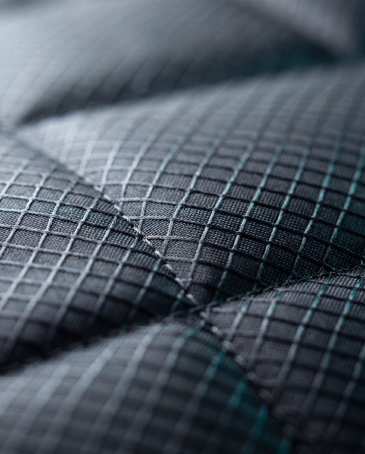 Close-up of ReHYV Pulse Pro premium technical fabric and bonded seams