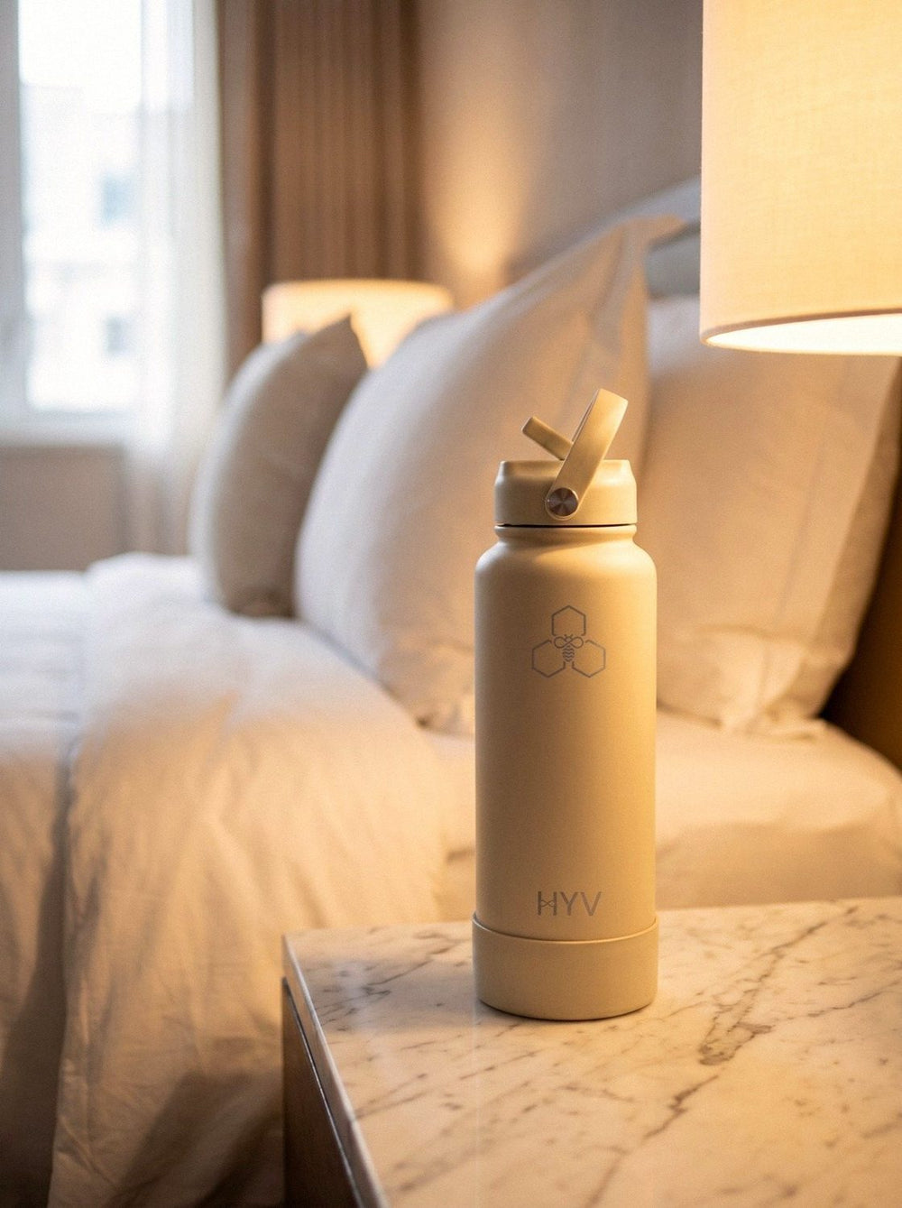 HYV bottle on a hotel bedside table in morning light